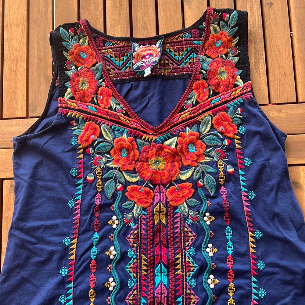 Johnny was dress size medium. Dark blue with embroidery.